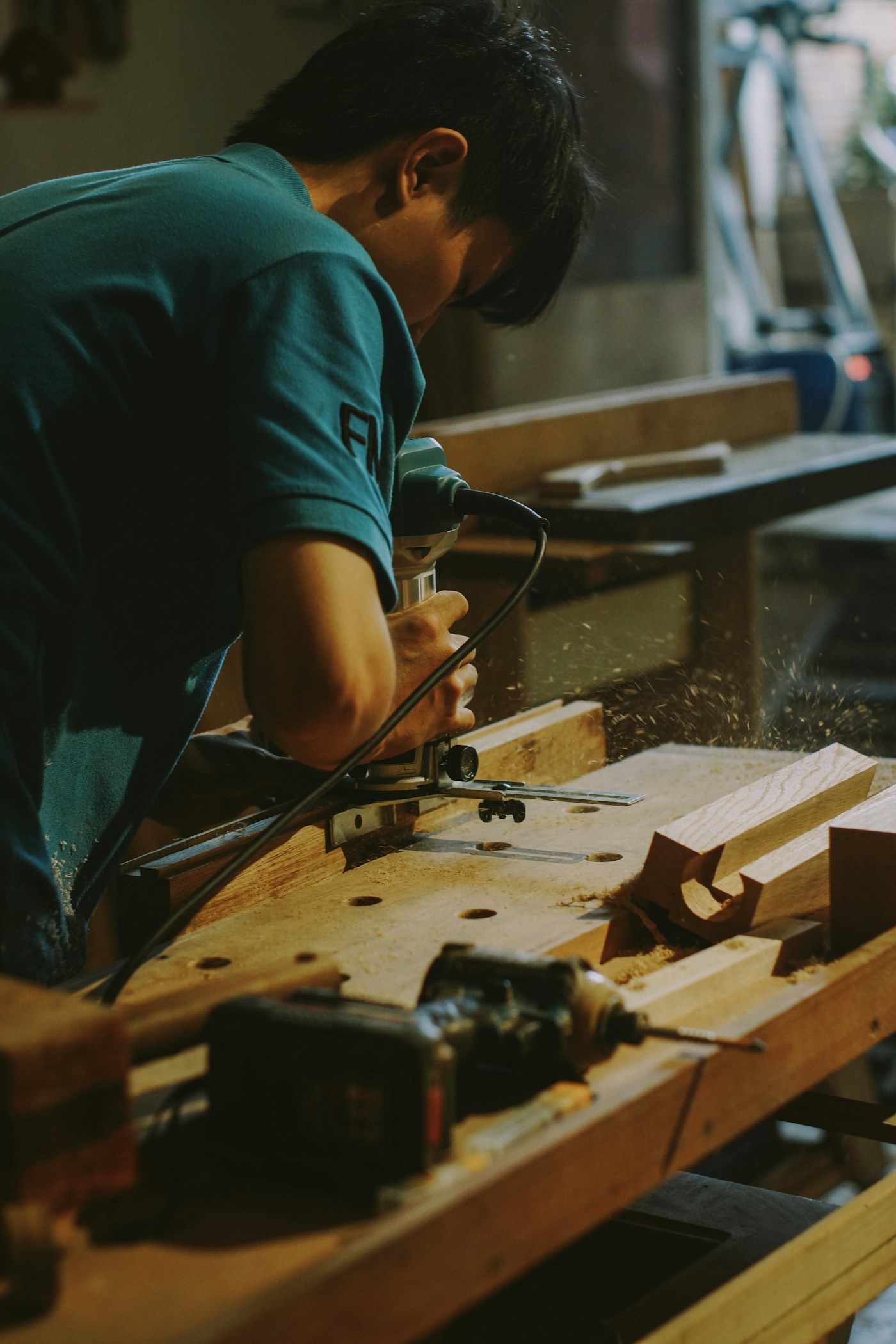A craftsperson working with timber, illustrating local trades