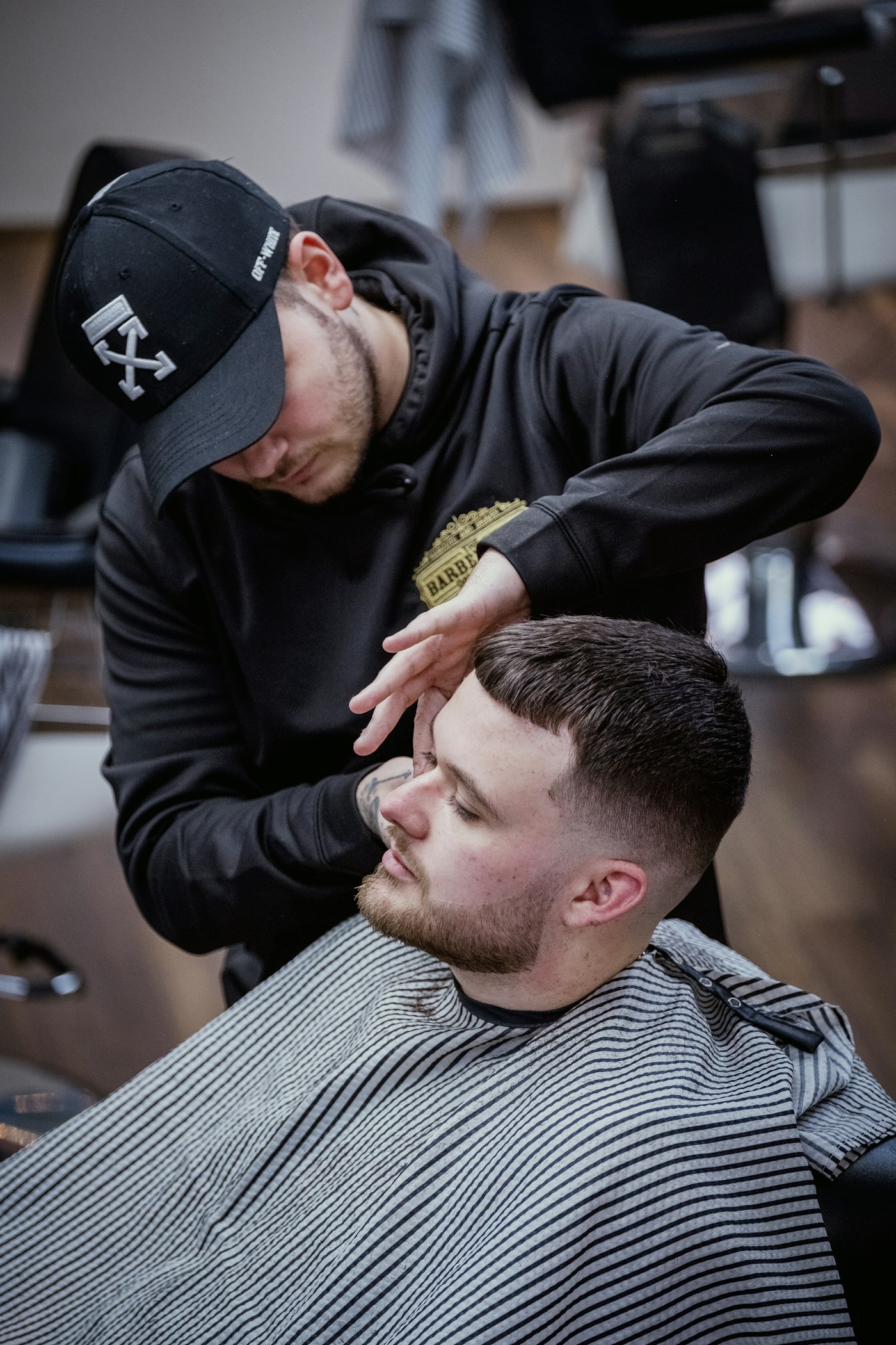 A barber serving a customer, illustrating appointment-based businesses